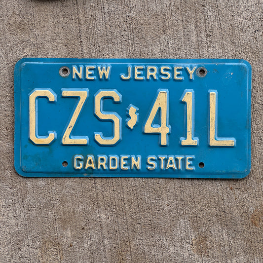 Photo of a 1979 New Jersey License Plate Auto Tag Garage Decor Vintage CZS 41L with original patina