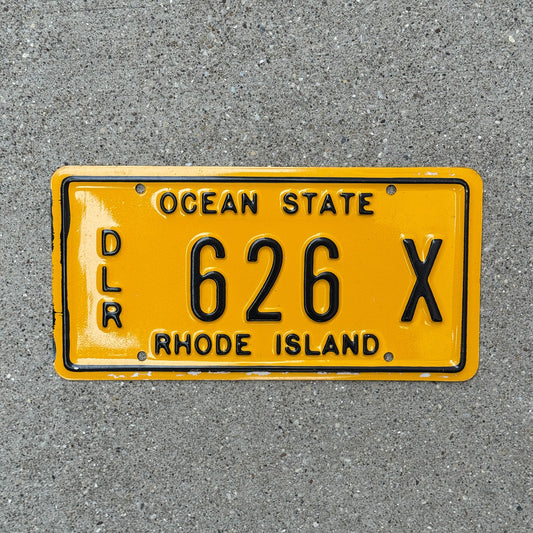 Photo of a 1979 Rhode Island Dealer License Plate Auto Tag Garage Decor Vintage Plastic 626 X with original patina