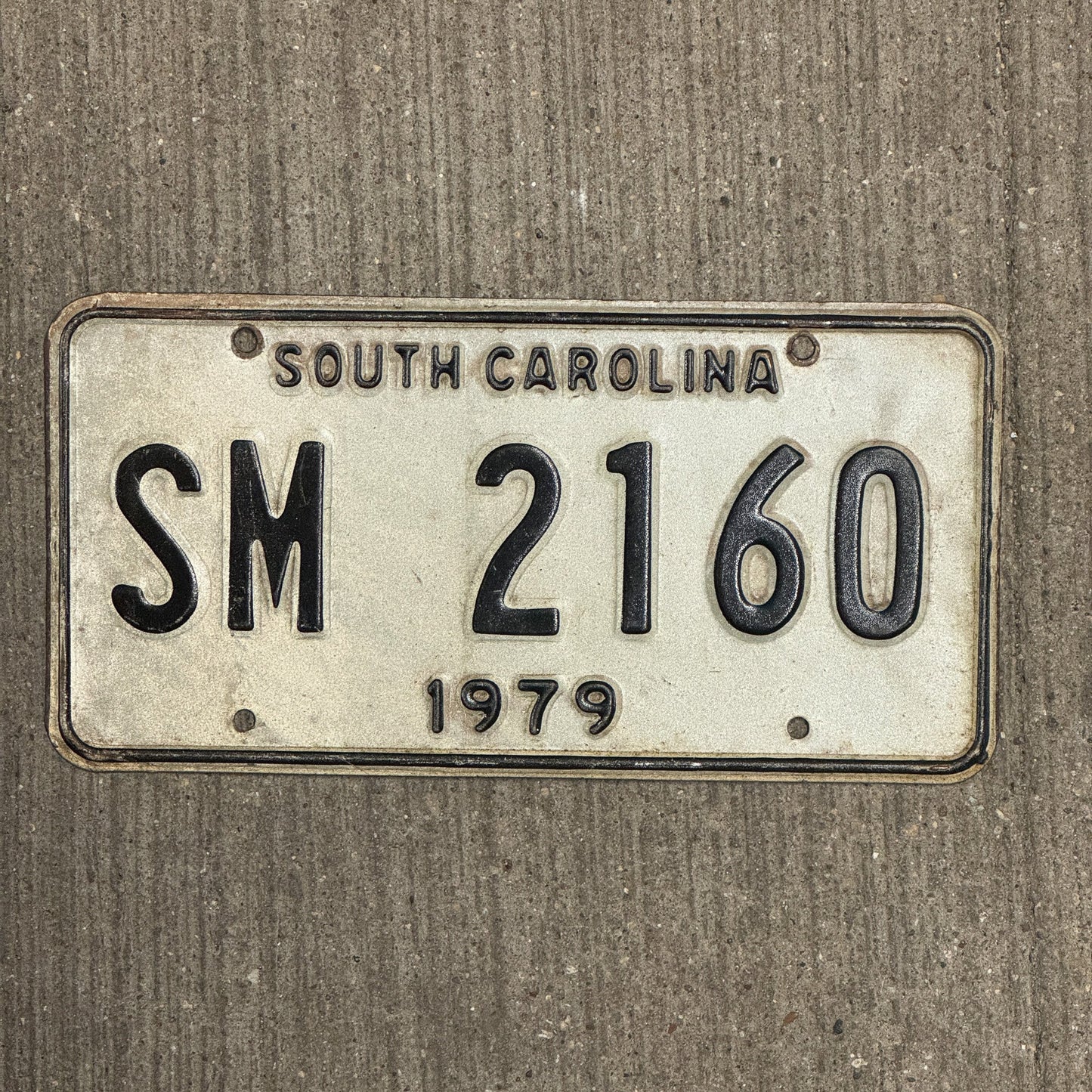 Photo of a 1979 South Carolina Special Mobile Equipment License Plate Auto Tag Garage Decor Vintage SM 2160 with original patina