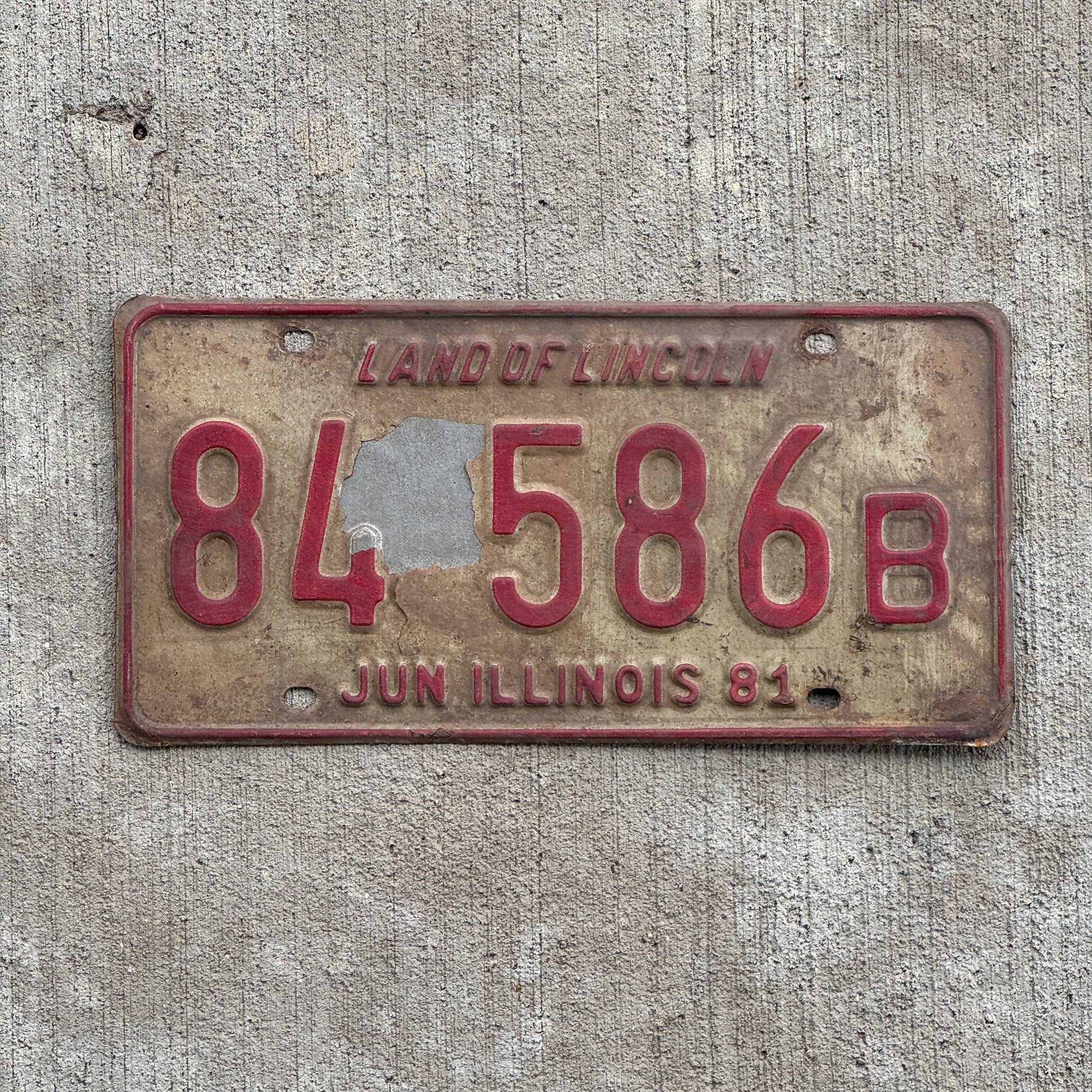 Photo of a 1980 1981 Illinois Truck License Plate Auto Tag Garage Decor Vintage 84 586 B with original patina