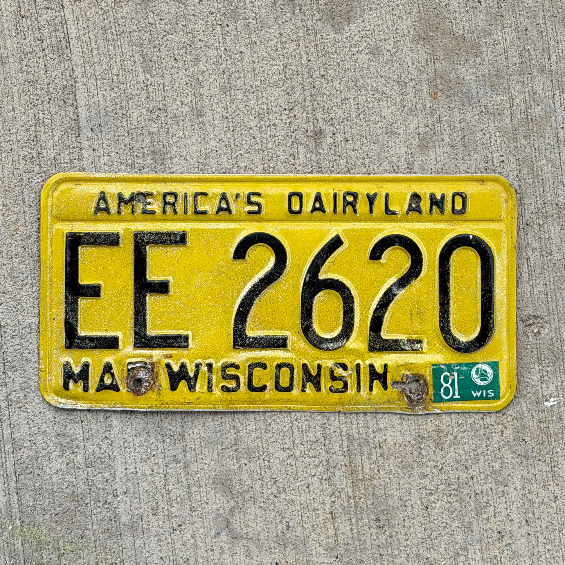 Photo of a 1980 1981 Wisconsin License Plate Auto Tag Garage Decor Vintage EE 2620 with original patina