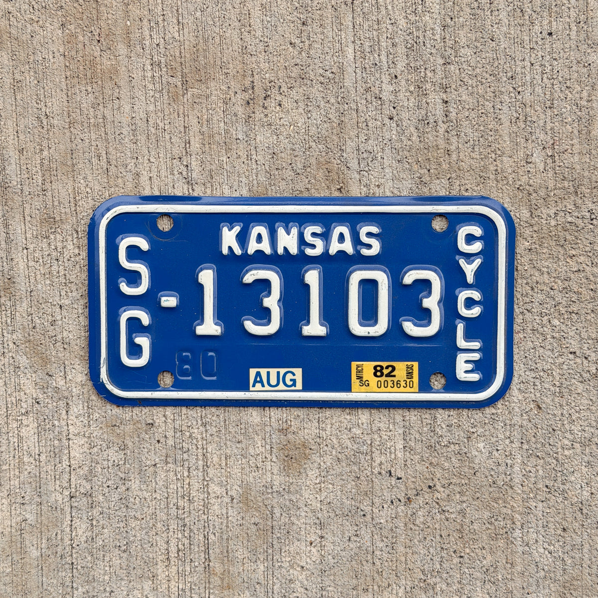 Photo of a 1980 1982 Kansas Motorcycle License Plate Auto Tag Garage Decor Vintage SG 13103 with original patina
