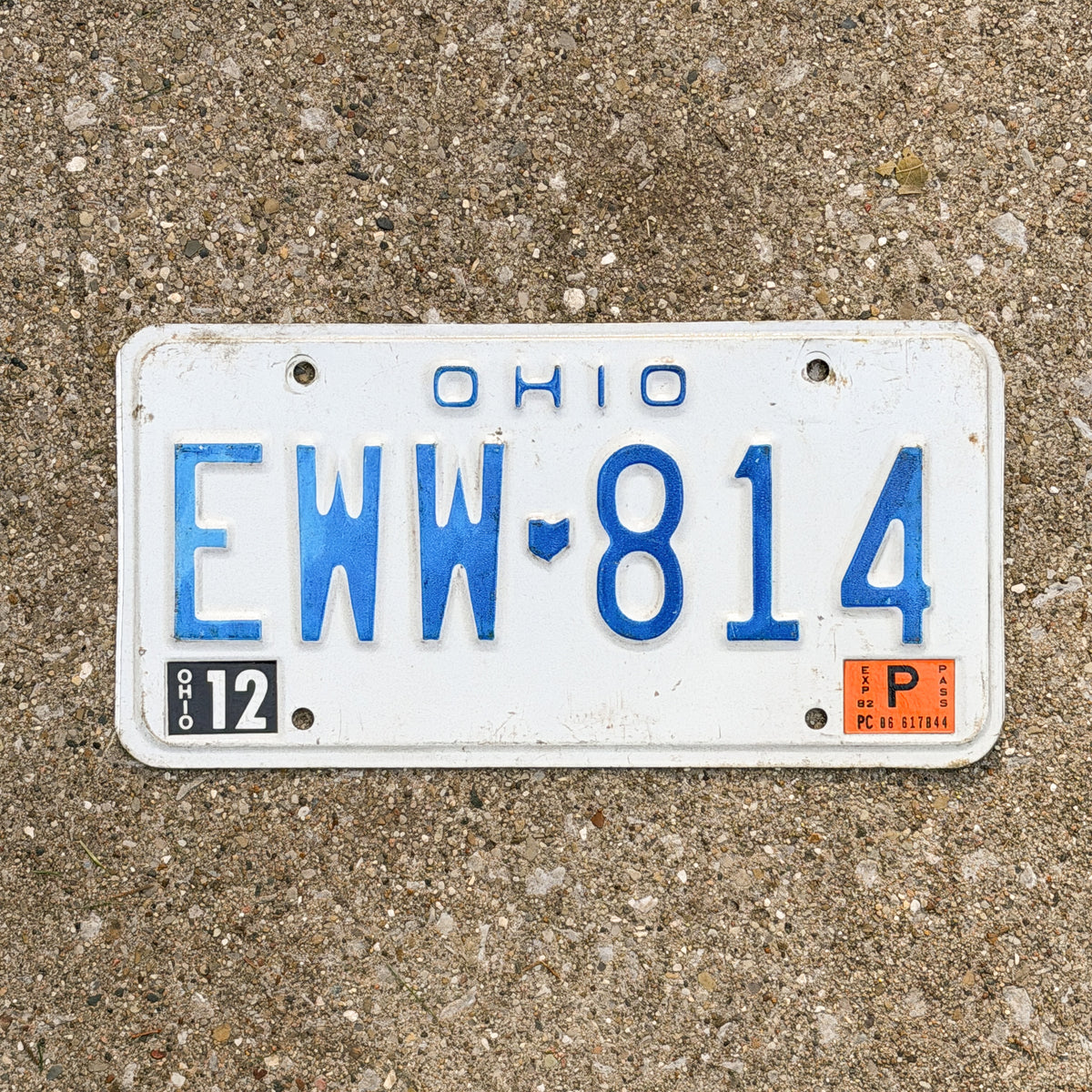Photo of a 1980 1982 Ohio License Plate Auto Tag 1 Vintage EWW 814 with original patina