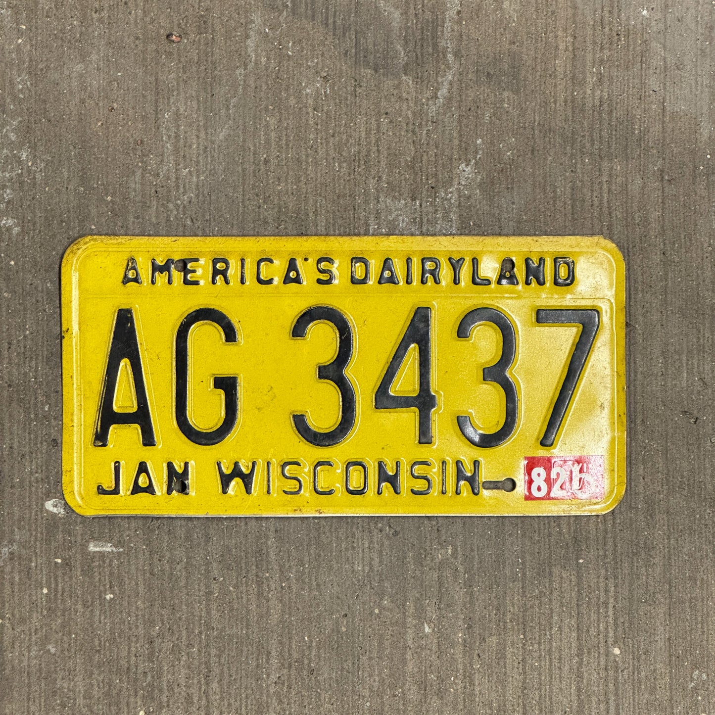 Photo of a 1980 1982 Wisconsin License Plate Auto Tag Garage Decor Vintage AG 3437 with original patina