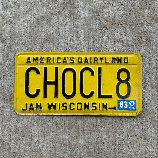 Photo of a 1980 1983 Wisconsin Vanity License Plate Auto Tag Garage Decor Vintage Chocolate Sweets Food CHOCL8 with original patina