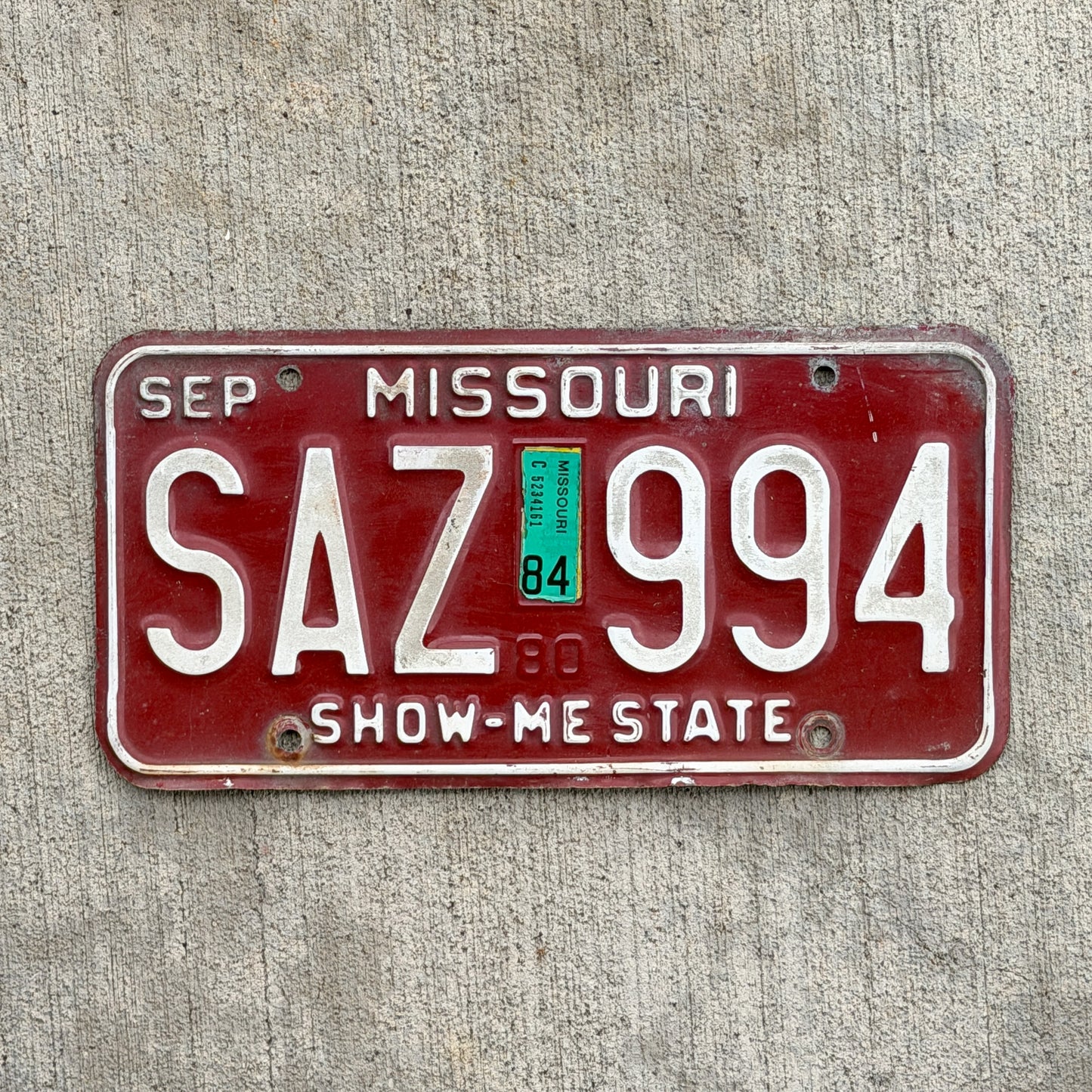 Photo of a 1980 1984 Missouri License Plate Auto Tag Garage Decor Vintage SAZ 994 with original patina