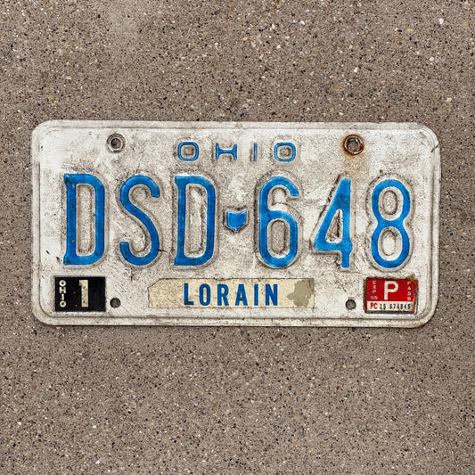 Photo of a 1980 1985 Ohio License Plate Auto Tag Garage Decor Vintage DSD 648 with original patina