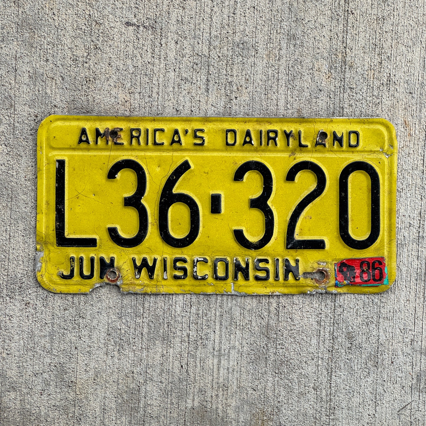 Photo of a 1980 1986 Wisconsin License Plate Auto Tag Garage Decor Vintage L36 320 with original patina