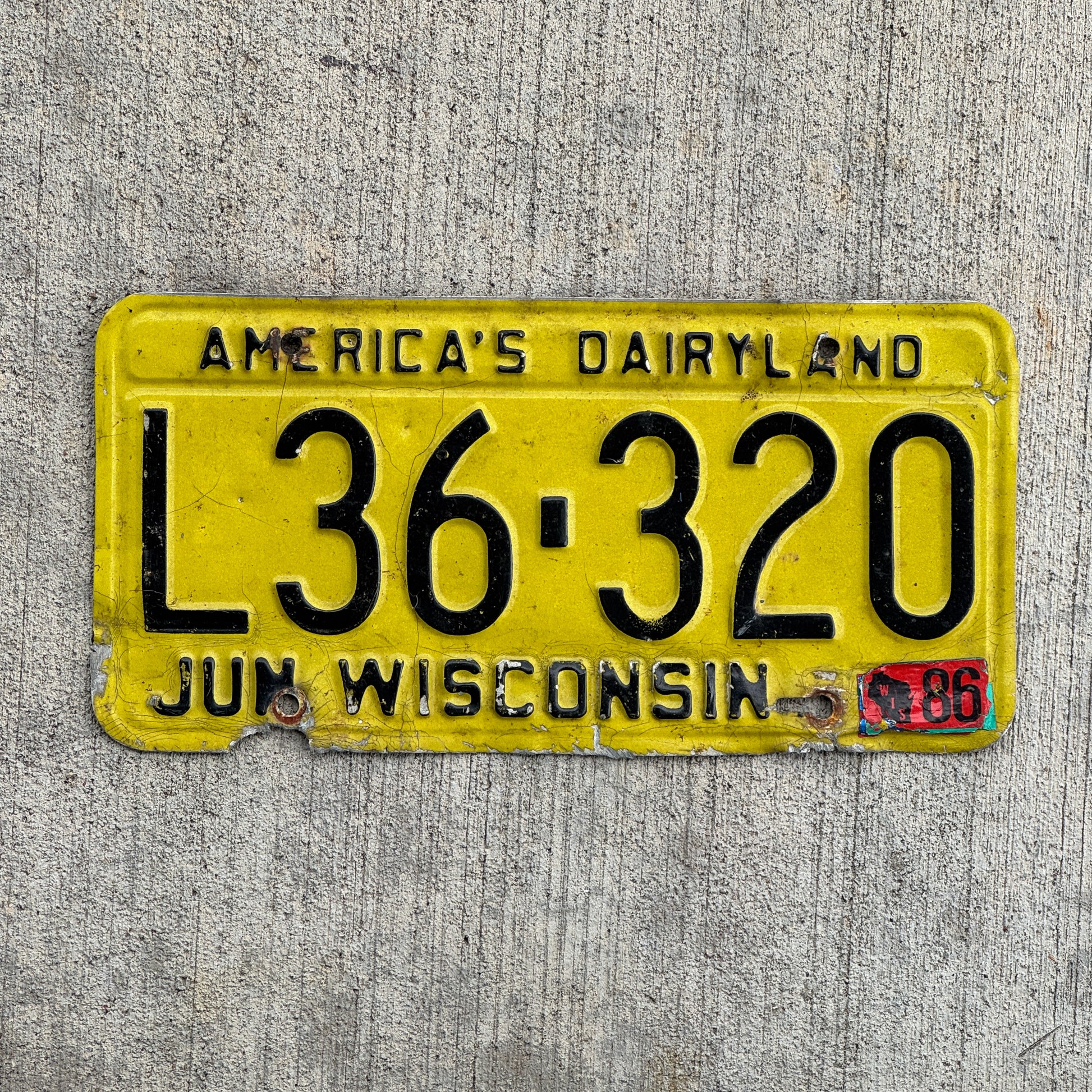 Photo of a 1980 1986 Wisconsin License Plate Auto Tag Garage Decor Vintage L36 320 with original patina