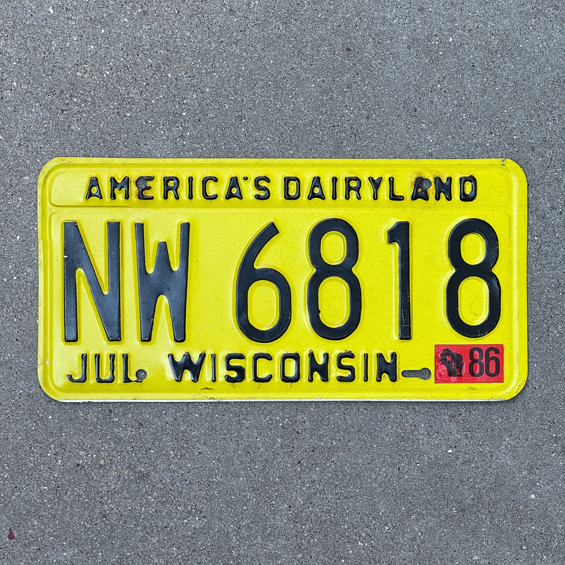 Photo of a 1980 1986 Wisconsin License Plate Auto Tag Garage Decor Vintage NW 6818 with original patina