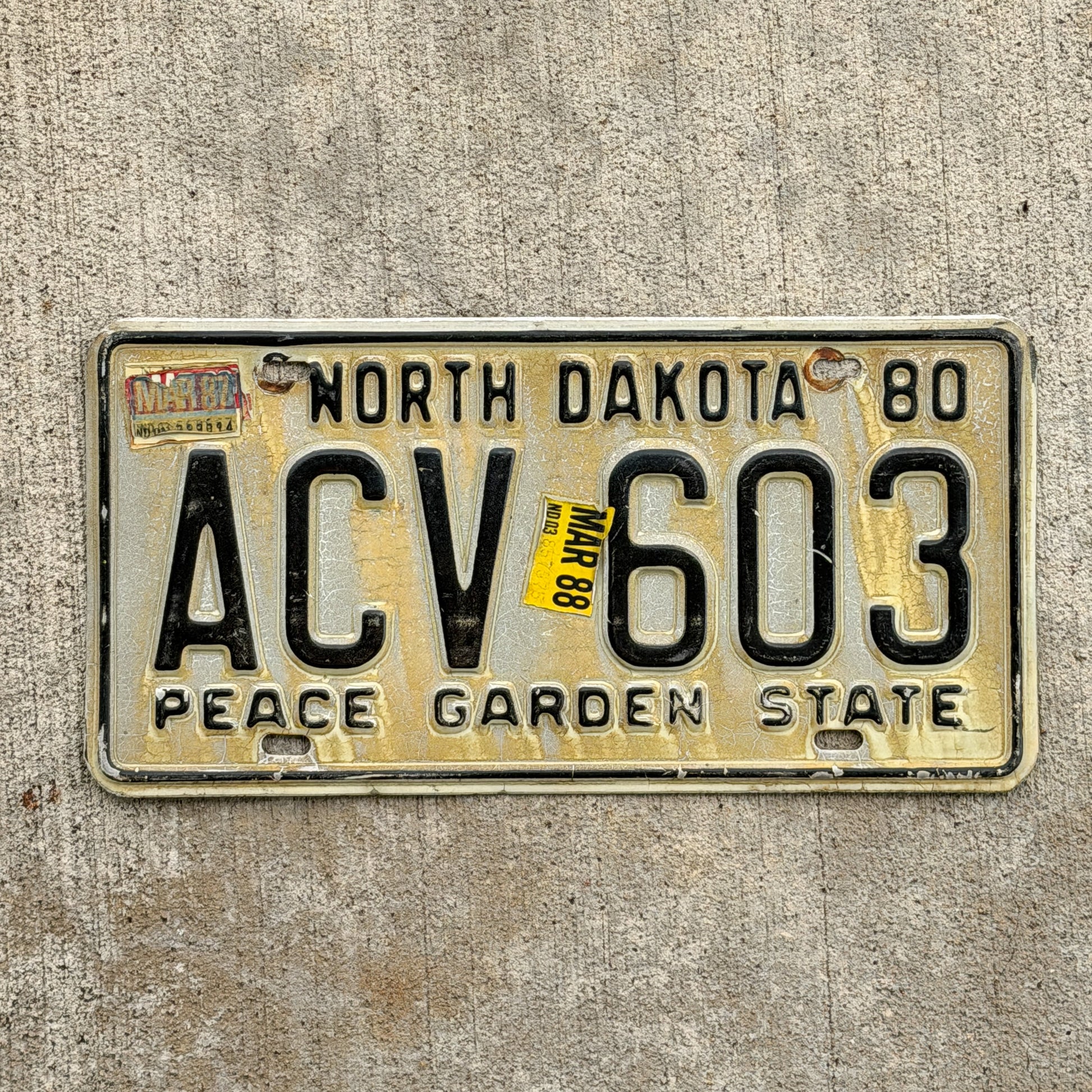 Photo of a 1980 1988 North Dakota License Plate Auto Tag Garage Decor Vintage ACV 603 with original patina