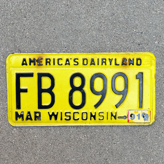 Photo of a 1980 1991 Wisconsin License Plate Auto Tag Garage Decor Vintage FB 8991 with original patina