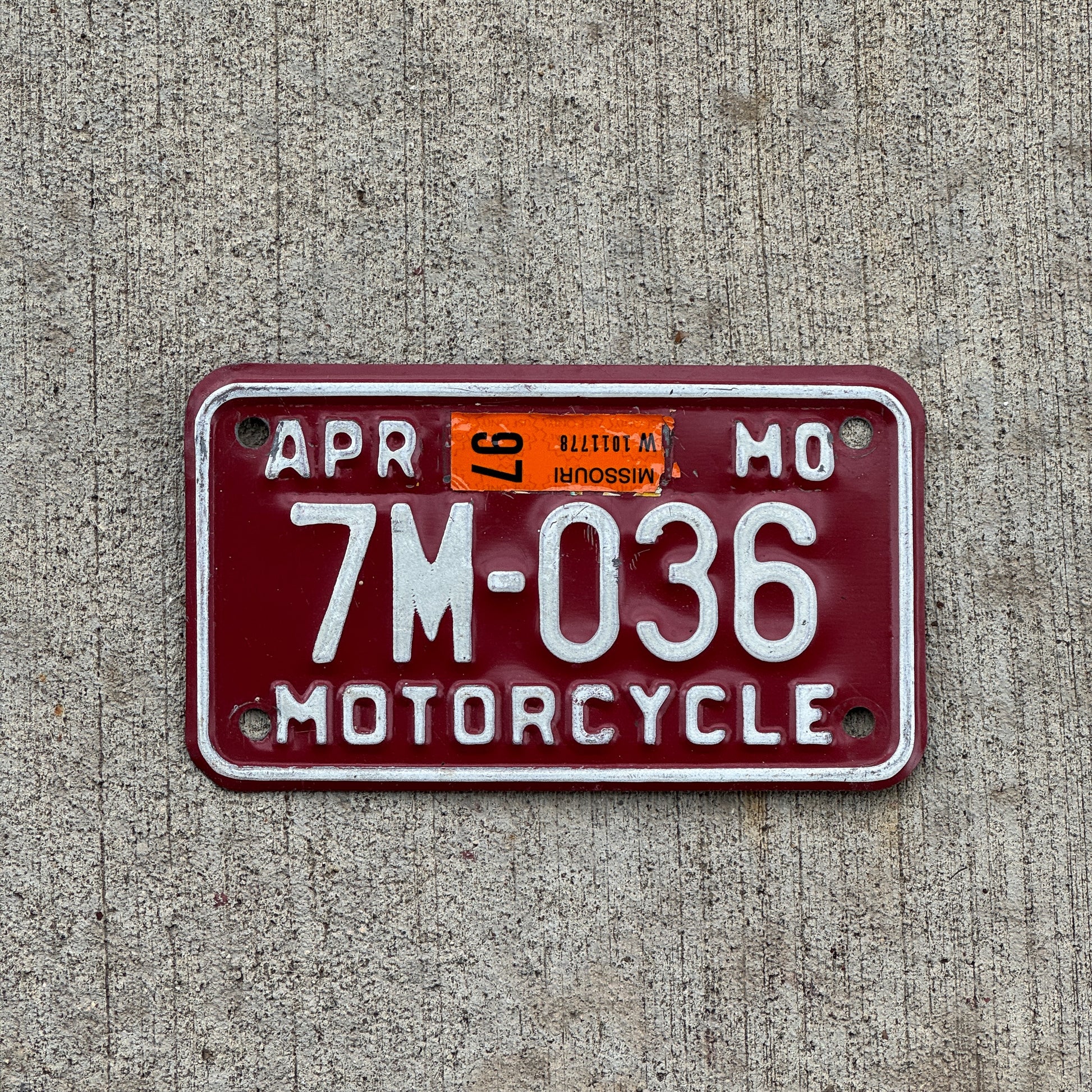 Photo of a 1980 1997 Missouri Motorcycle License Plate Auto Tag Garage Decor Vintage 7M 036 with original patina