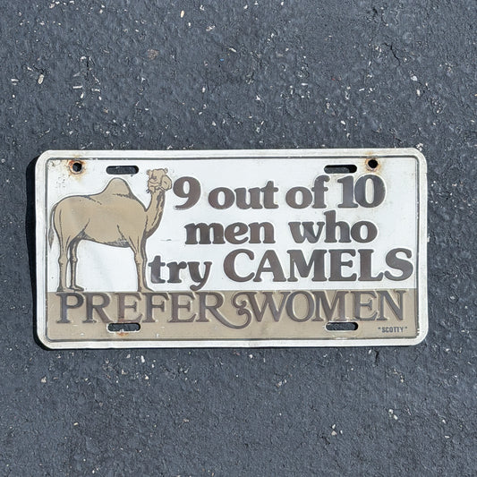 Photo of a 1980 Era 9 out of 10 men who try CAMELS Prefer Women Booster License Plate Auto Tag Garage Decor Vintage
 Novelty Joke Gift Metal with original patina