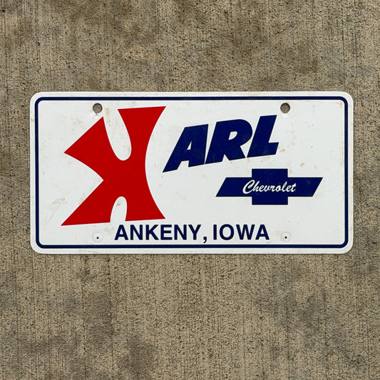 Photo of a 1980 Era Ankeny Iowa Booster License Plate Auto Tag Garage Decor Vintage Karl Chevy Plastic with original patina