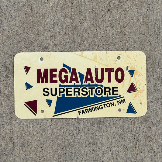Photo of a 1980 Era Farmington New Mexico Booster License Plate Auto Tag Garage Decor Vintage Mega Auto Superstore Flimsy Plastic with original patina