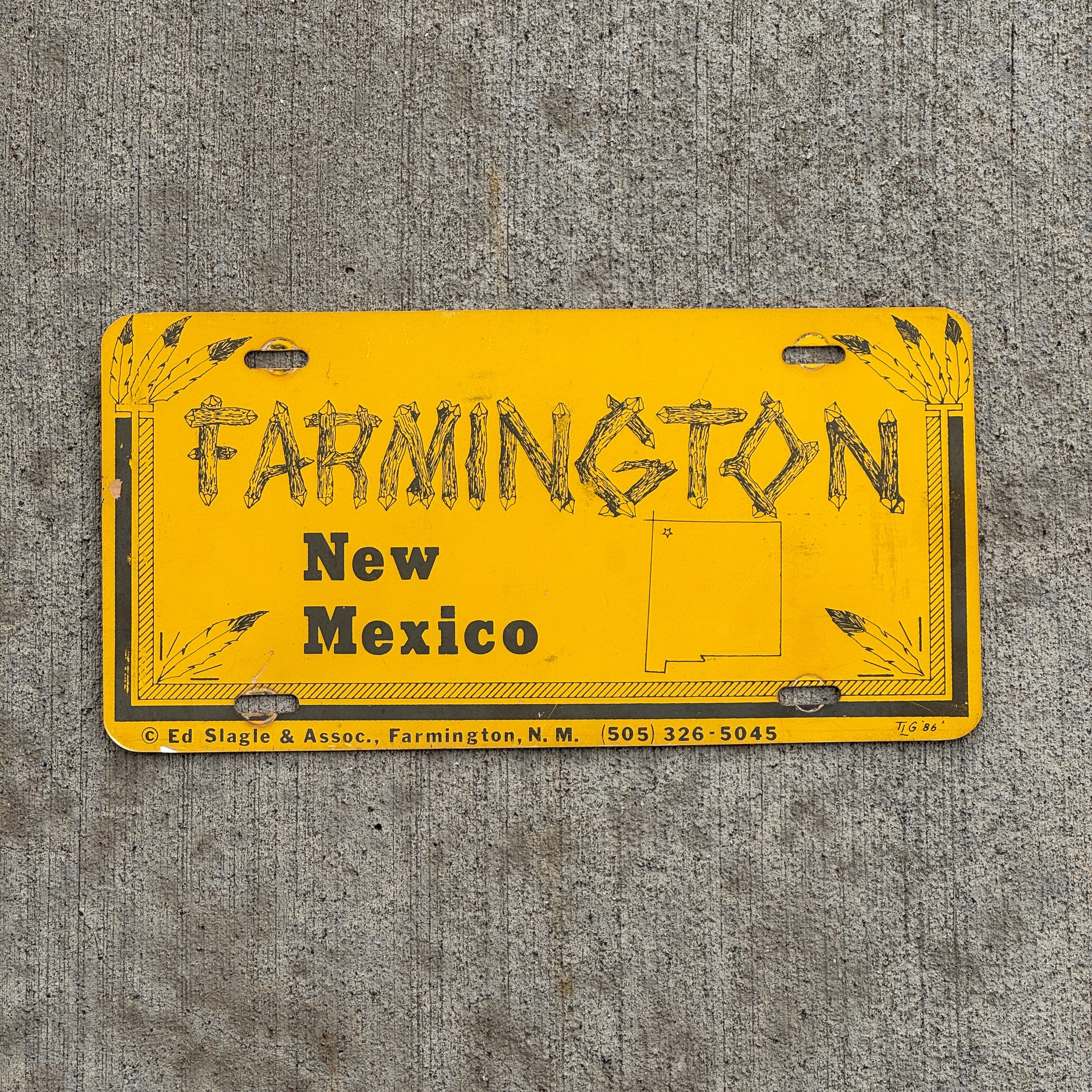 Photo of a 1980 Era Farmington New Mexico Booster License Plate Auto Tag Garage Decor Vintage Plastic with original patina