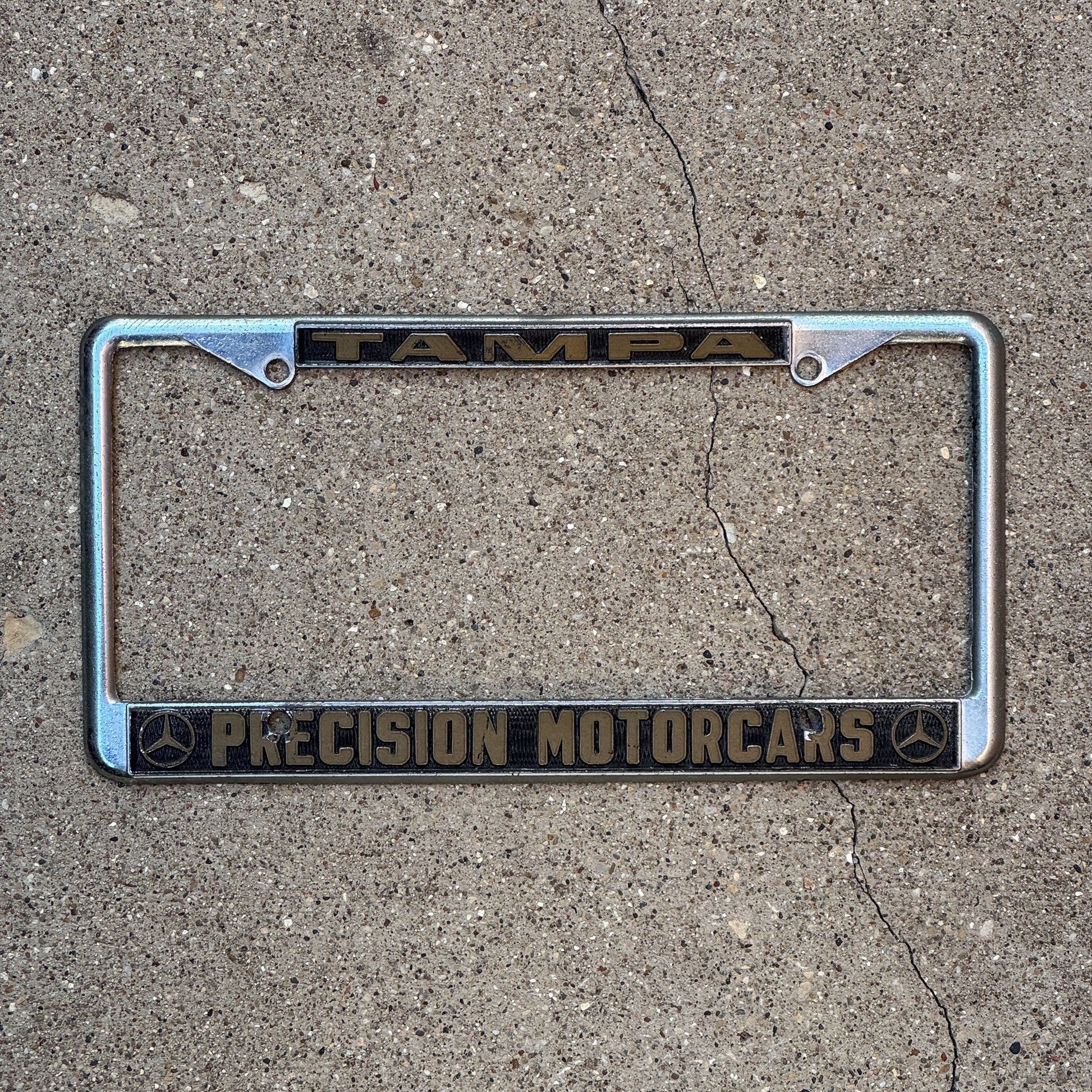 Photo of a 1980 Era Florida License Plate Frame Auto Tag Garage Decor Vintage Precision Motorcars Mercedes Benz Tampa Precision Motorcars with original patina