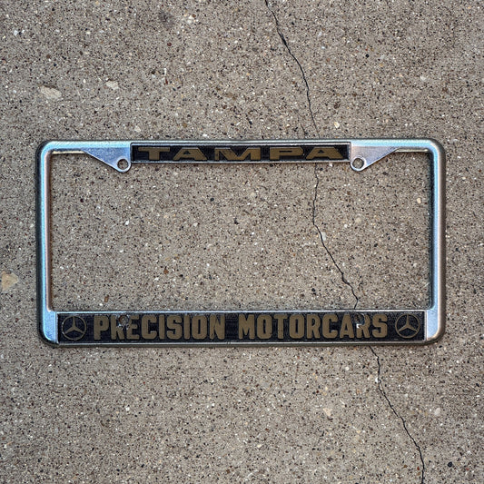 Photo of a 1980 Era Florida License Plate Frame Auto Tag Garage Decor Vintage Precision Motorcars Mercedes Benz Tampa Precision Motorcars with original patina