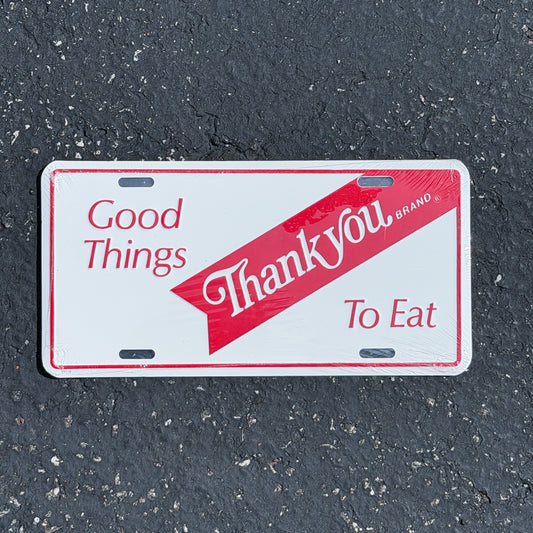 Photo of a 1980 Era Good Things to Eat Thank You Brand Booster License Plate Auto Tag Garage Decor Vintage
 Metal with original patina