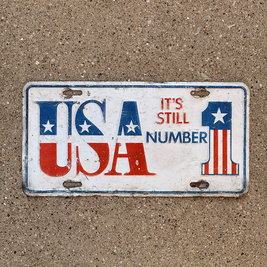 Photo of a 1980 Era License Plate Auto Tag Garage Decor Vintage America Patriotic USA It's Still Number 1