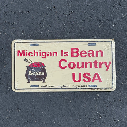 Photo of a 1980 Era Michigan Booster License Plate Auto Tag Garage Decor Vintage
 Bean Country Metal NOS with original patina