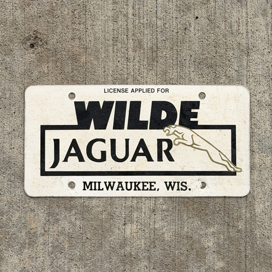 Photo of a 1980 Era Milwaukee Wisconsin Booster License Plate Auto Tag Garage Decor Vintage Wilde Jaguar Paper with original patina