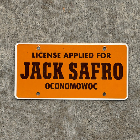Photo of a 1980 Era Oconomowoc Wisconsin Booster License Plate Auto Tag Garage Decor Vintage Jack Safro Ford Lincoln Mercury Paper with original patina