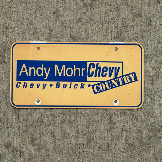 Photo of a 1980 Era Plainfield Indiana Booster License Plate Auto Tag Garage Decor Vintage Andy Mohr Chevy Buick Plastic with original patina