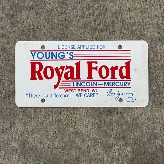 Photo of a 1980 Era West Bend Wisconsin Booster License Plate Auto Tag Garage Decor Vintage Royal Ford Lincoln Mercury Plastic with original patina