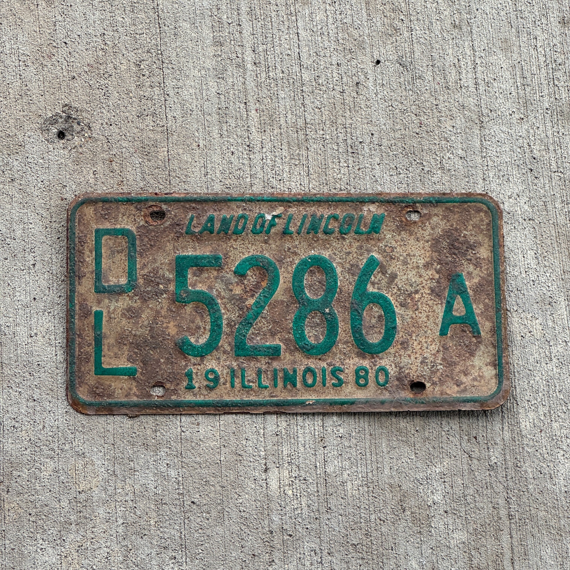 Photo of a 1980 Illinois Dealer License Plate Auto Tag 2 Vintage Garage 5286 A with original patina