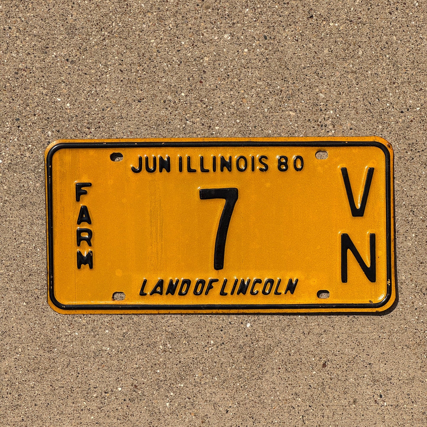 Photo of a 1980 Illinois Farm License Plate Auto Tag Garage Decor Vintage Low Number 7 VN