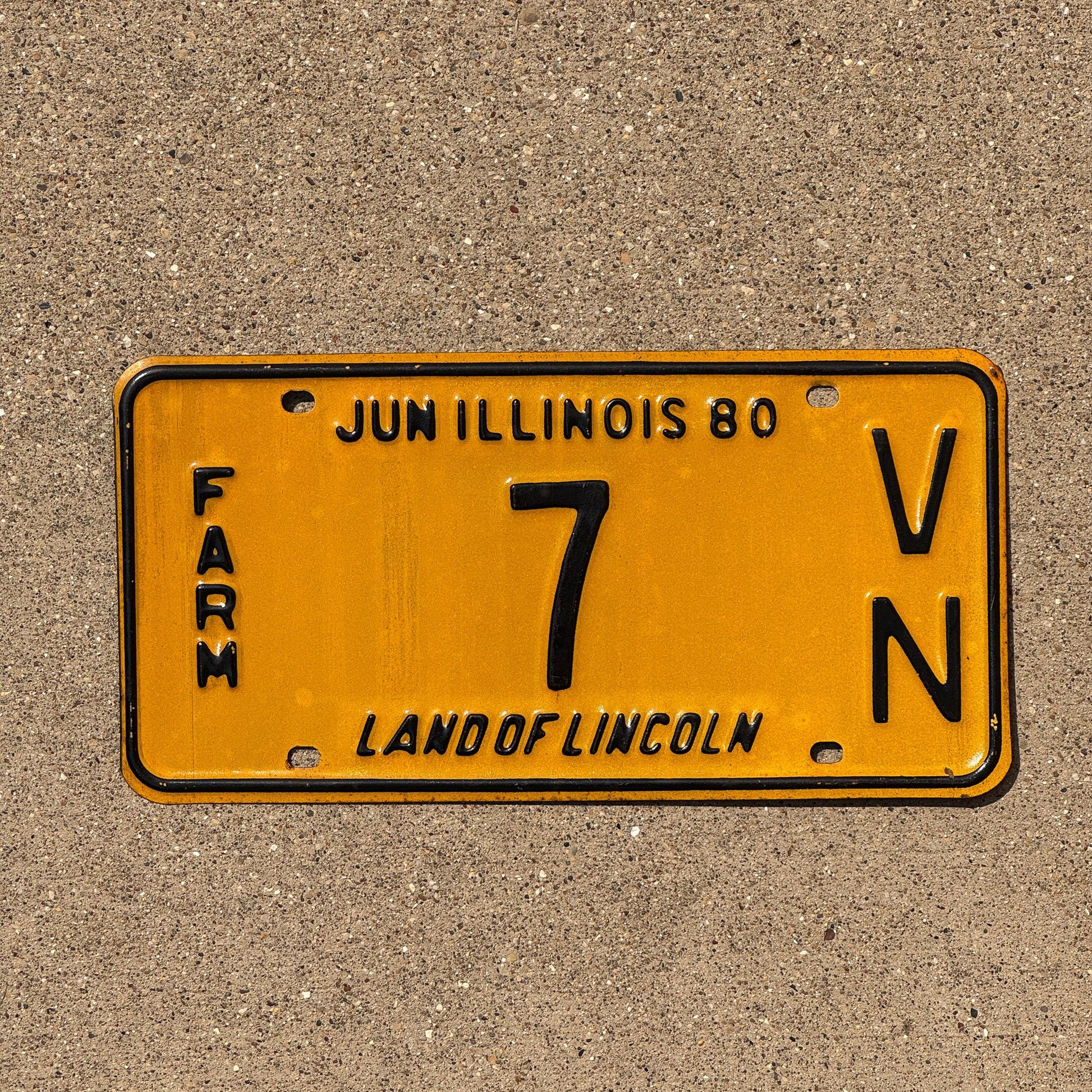 Photo of a 1980 Illinois Farm License Plate Auto Tag Garage Decor Vintage Low Number 7 VN