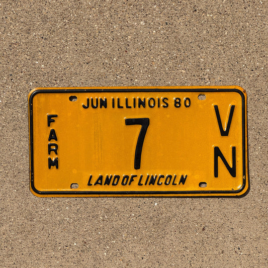 Photo of a 1980 Illinois Farm License Plate Auto Tag Garage Decor Vintage Low Number 7 VN