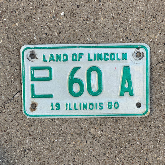 Photo of a 1980 Illinois Motorcycle Dealer License Plate Auto Tag Garage Decor Vintage 60 A with original patina