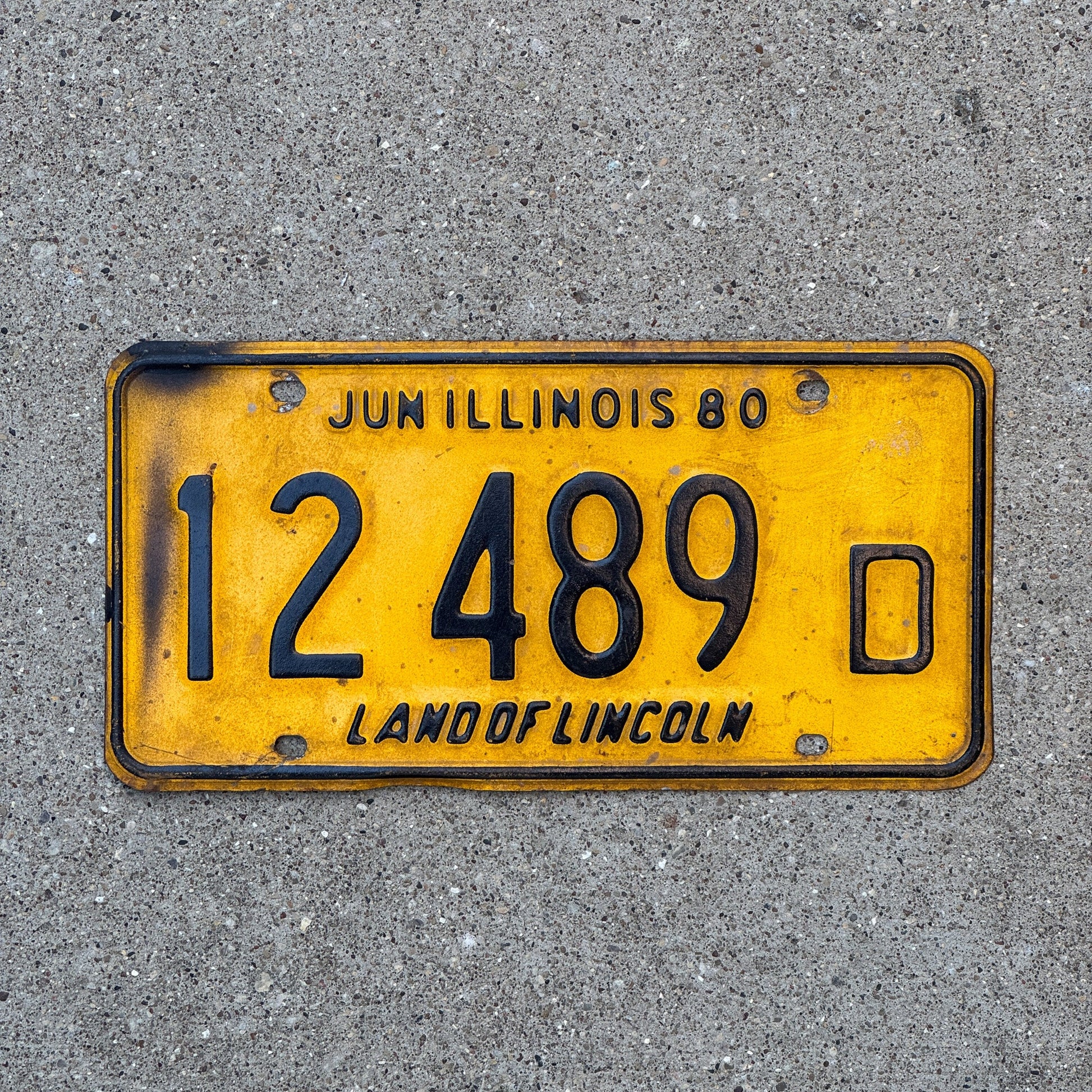 Photo of a 1980 Illinois Truck License Plate Auto Tag Garage Decor Vintage 12 489 D with original patina
