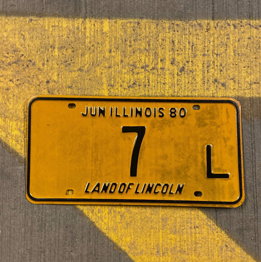 Photo of a 1980 Illinois Truck License Plate Auto Tag Garage Decor Vintage Low Number Single Digit 7 L with original patina