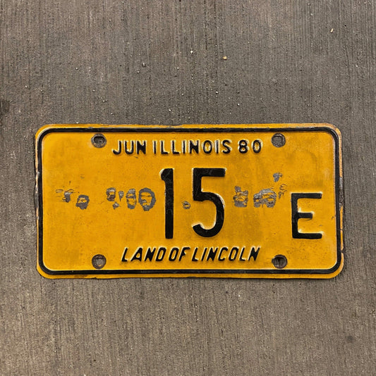 Photo of a 1980 Illinois Truck License Plate Auto Tag Garage Decor Vintage Low Number Two Digit 15 E with original patina
