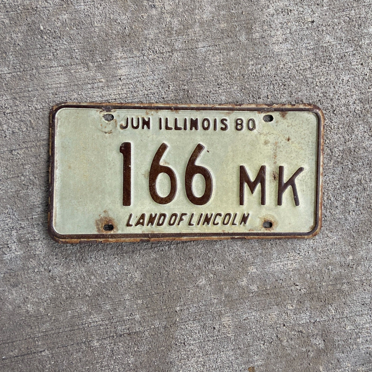 Photo of a 1980 Illinois Truck Mileage Tax License Plate Auto Tag Garage Decor Vintage 166 MK with original patina