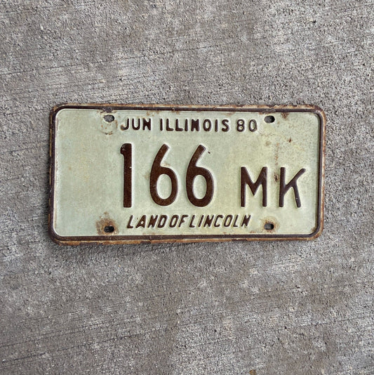 Photo of a 1980 Illinois Truck Mileage Tax License Plate Auto Tag Garage Decor Vintage 166 MK with original patina