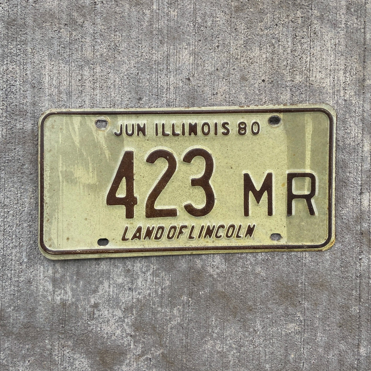 Photo of a 1980 Illinois Truck Mileage Tax License Plate Auto Tag Garage Decor Vintage 423 MR with original patina