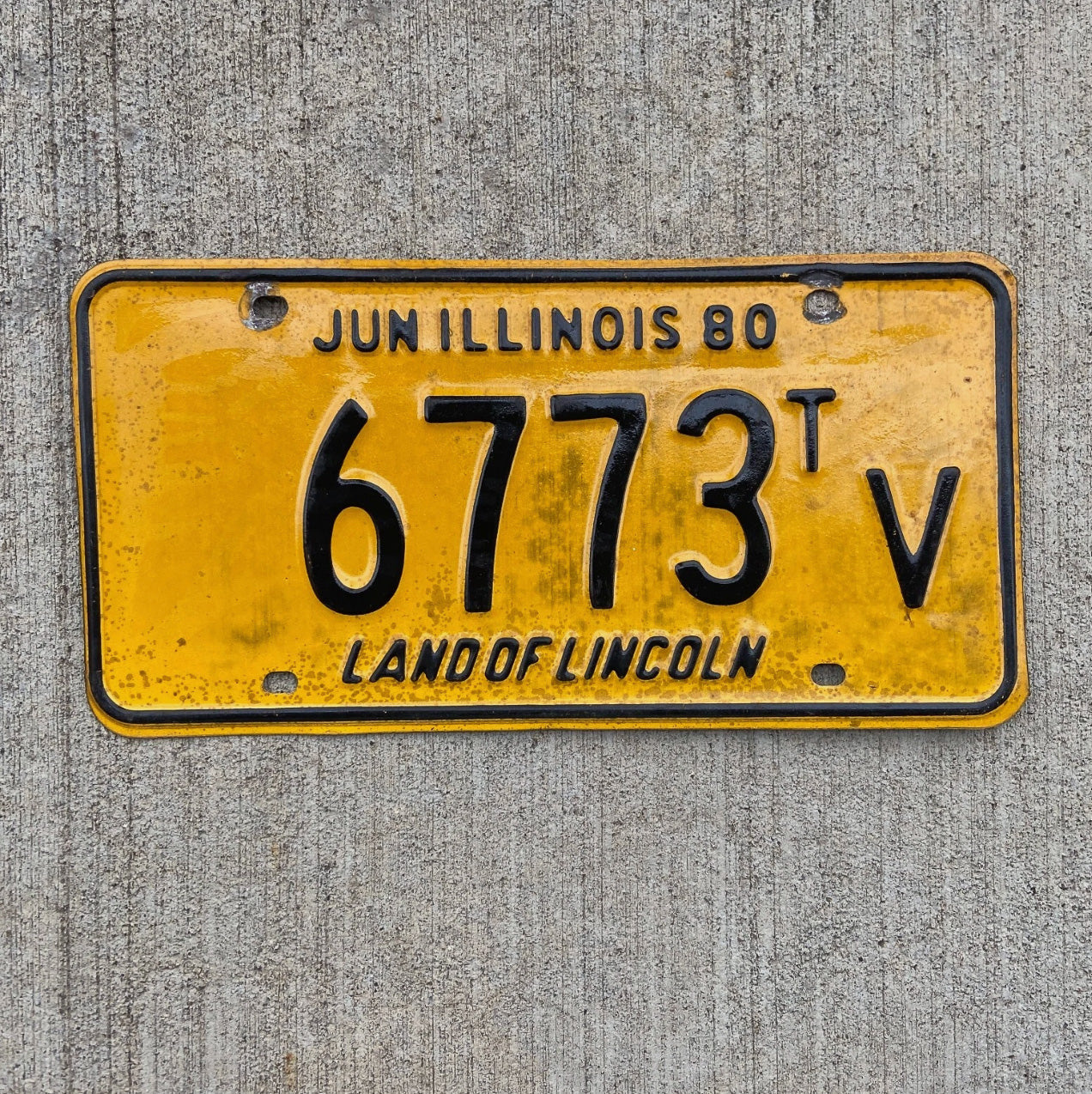 Photo of a 1980 Illinois Truck Tractor License Plate Auto Tag Garage Decor Vintage 6773 TV with original patina