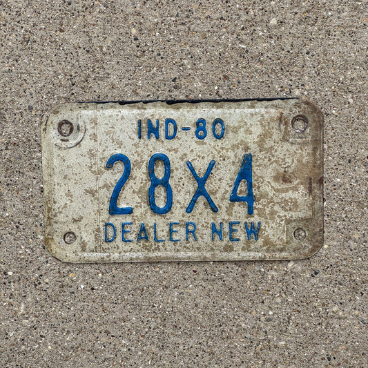 Photo of a 1980 Indiana Motorcycle Dealer License Plate Auto Tag Garage Decor Vintage 28 X 4 with original patina
