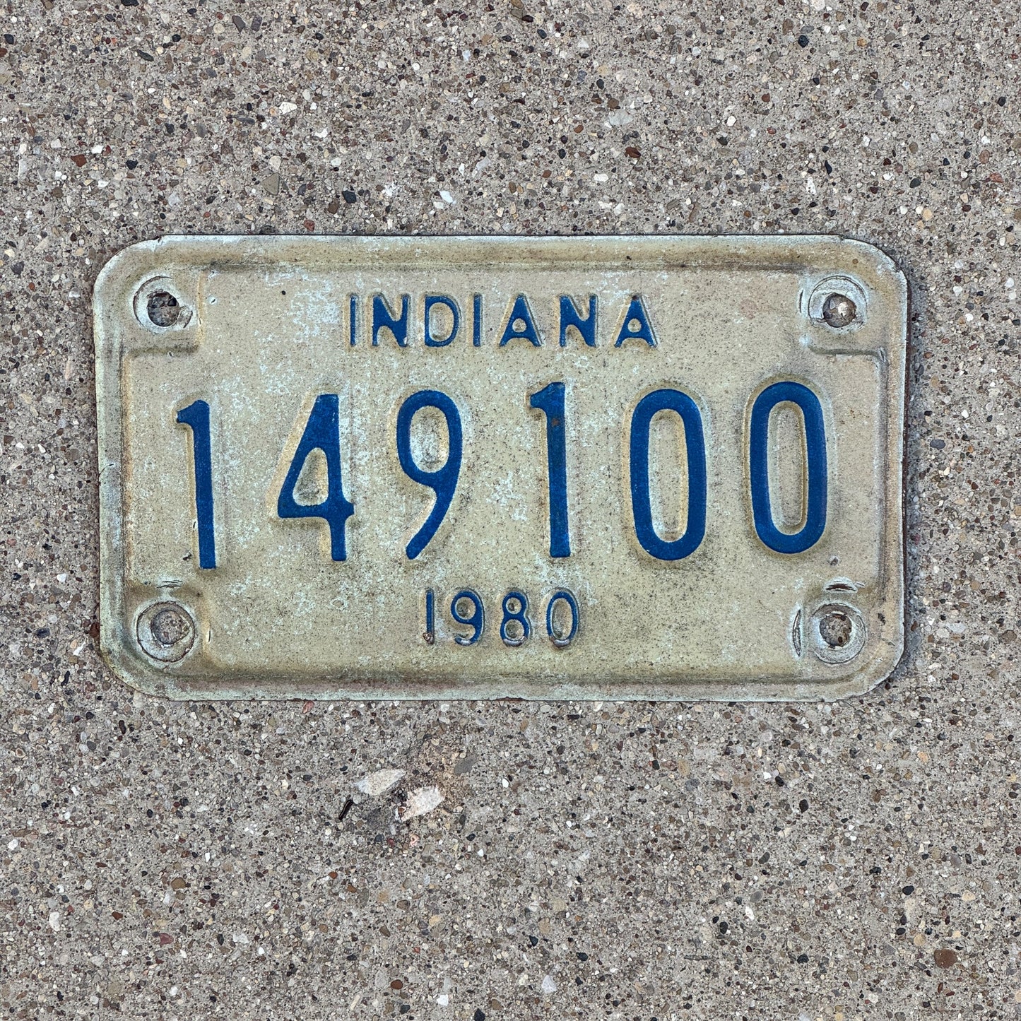 Photo of a 1980 Indiana Motorcycle License Plate Auto Tag Garage Decor Vintage 149100 with original patina