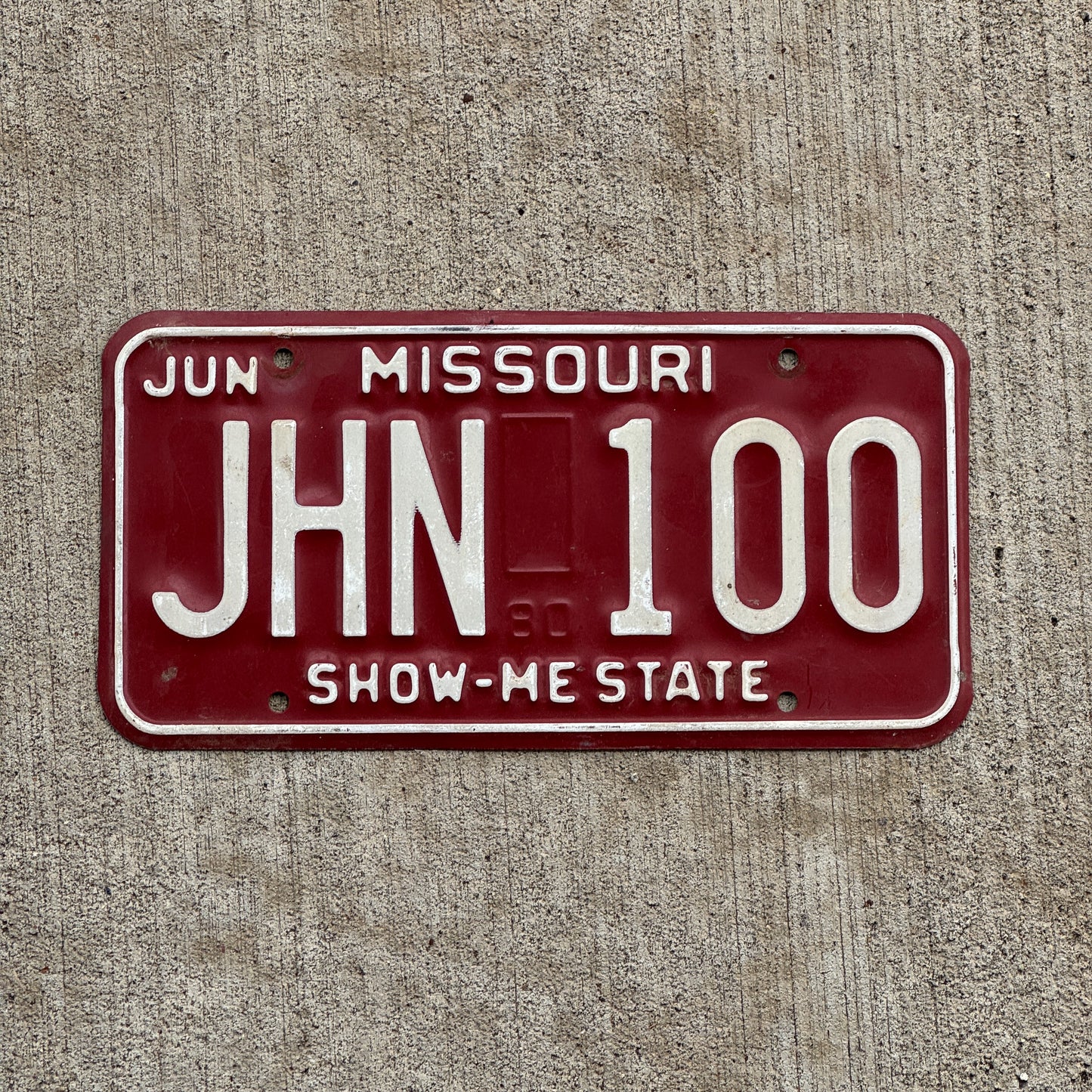 Photo of a 1980 Missouri License Plate Auto Tag Garage Decor Vintage JHN 100 with original patina