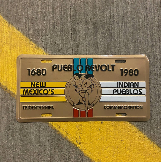 Photo of a 1980 New Mexico Booster License Plate Auto Tag Garage Decor Vintage Indian Native American Pueblo Revolt with original patina