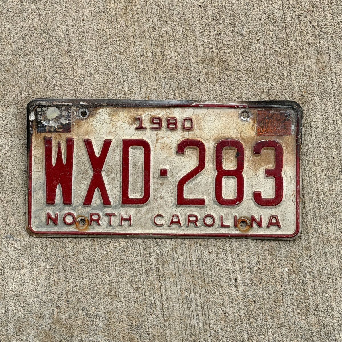 Photo of a 1980 North Carolina License Plate Auto Tag Garage Decor Vintage WXD 283 with original patina