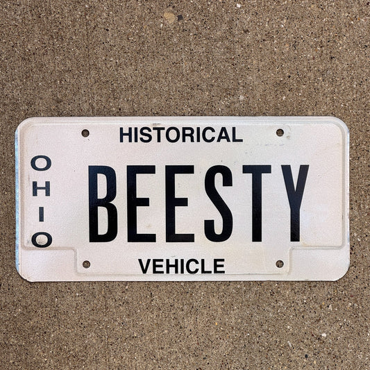 Photo of a 1980 Ohio Historical Vehicle Vanity License Plate Auto Tag Garage Decor Vintage Bees Besty BEESTY with original patina