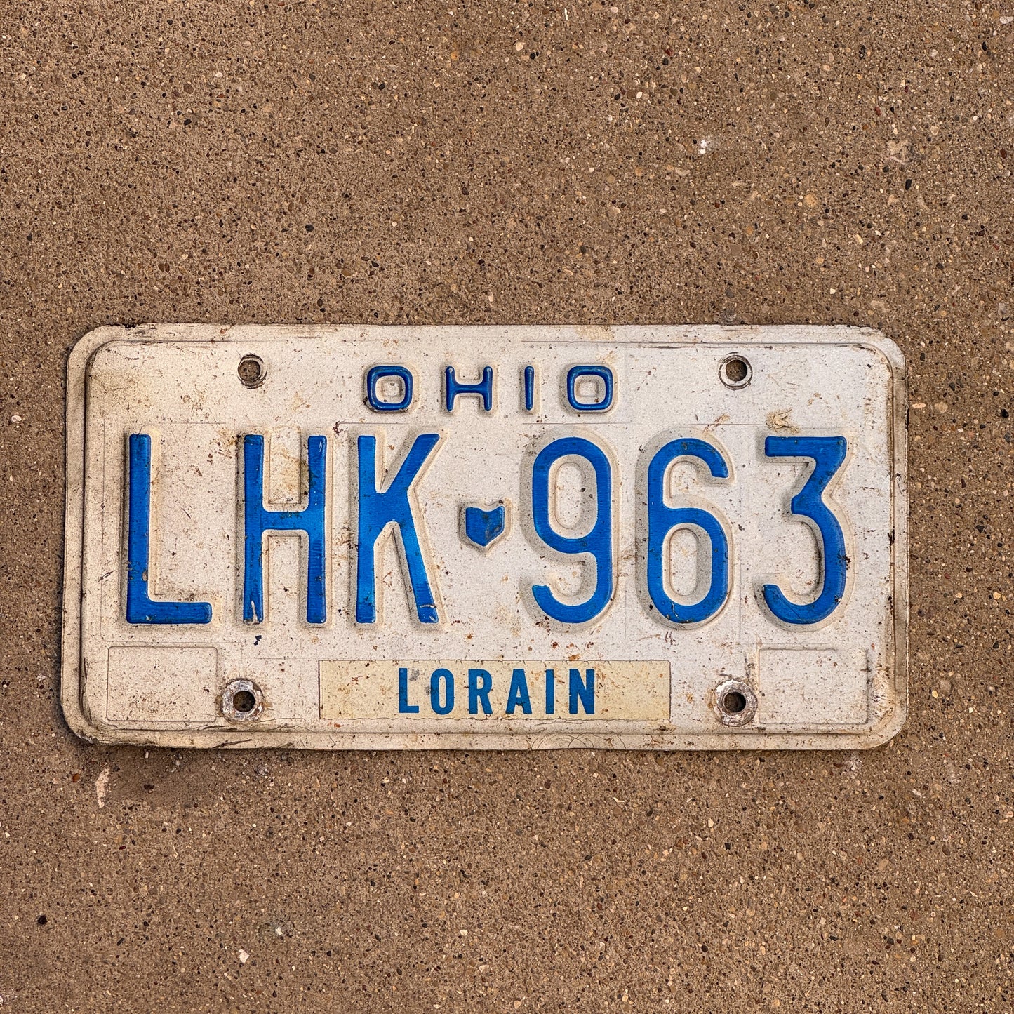 Photo of a 1980 Ohio License Plate Auto Tag 1 Vintage Garage LHK 963 with original patina