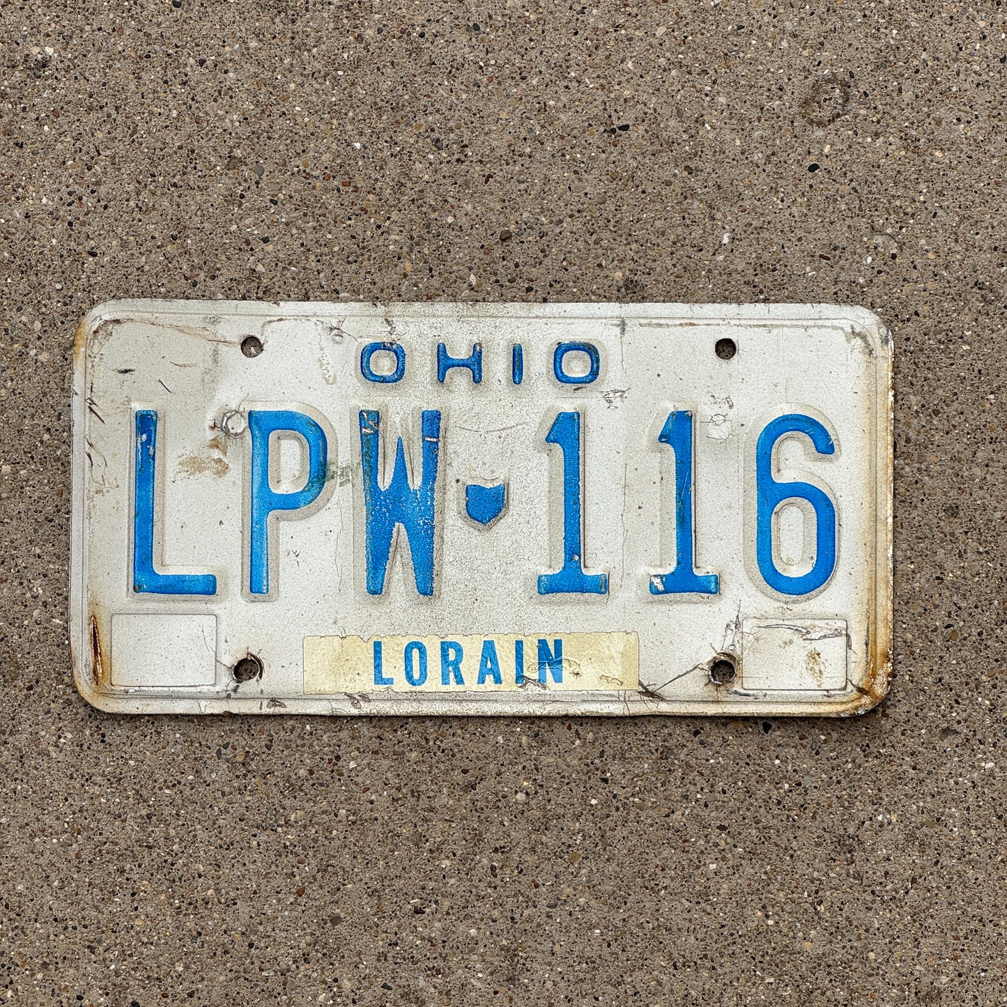 Photo of a 1980 Ohio License Plate Auto Tag 1 Vintage Garage LPW 116 with original patina